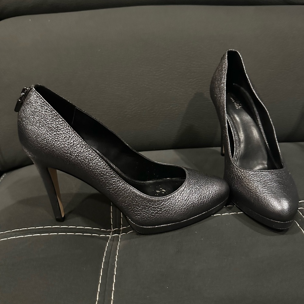 Silver Michael Kors pumps worn five times. Still like new.